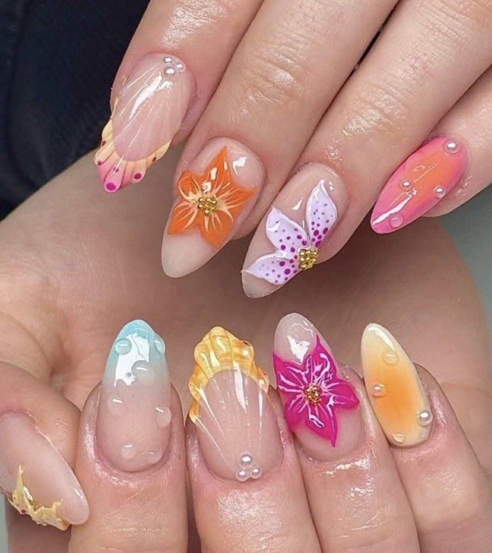 Almond nails with multicolor 3D sculpted flowers and pearl detailing