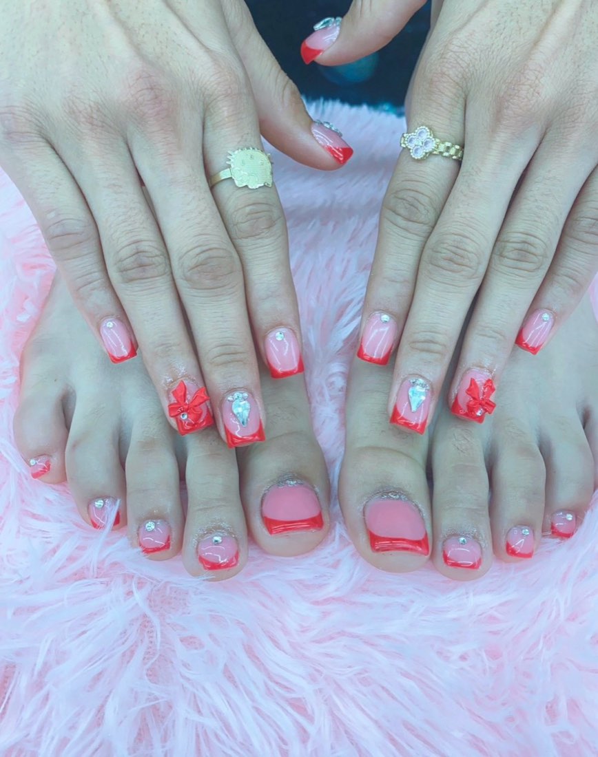 Coral french manicure and matching pedicure with 3D bows and rhinestones