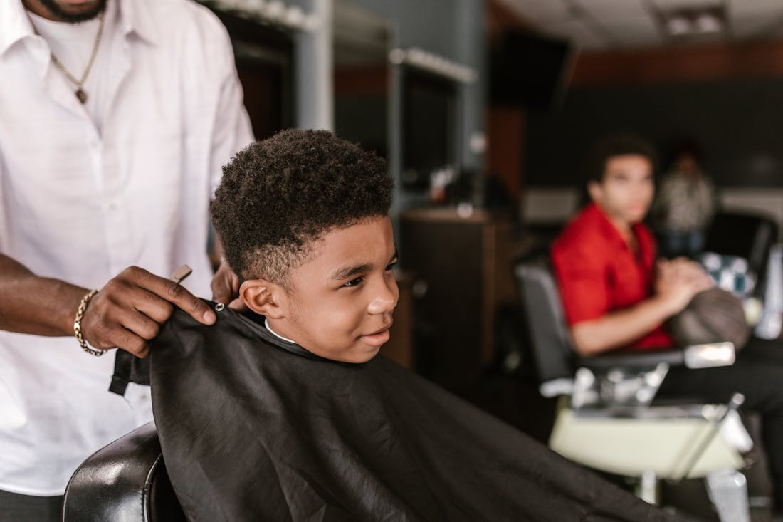 A young client getting caped up