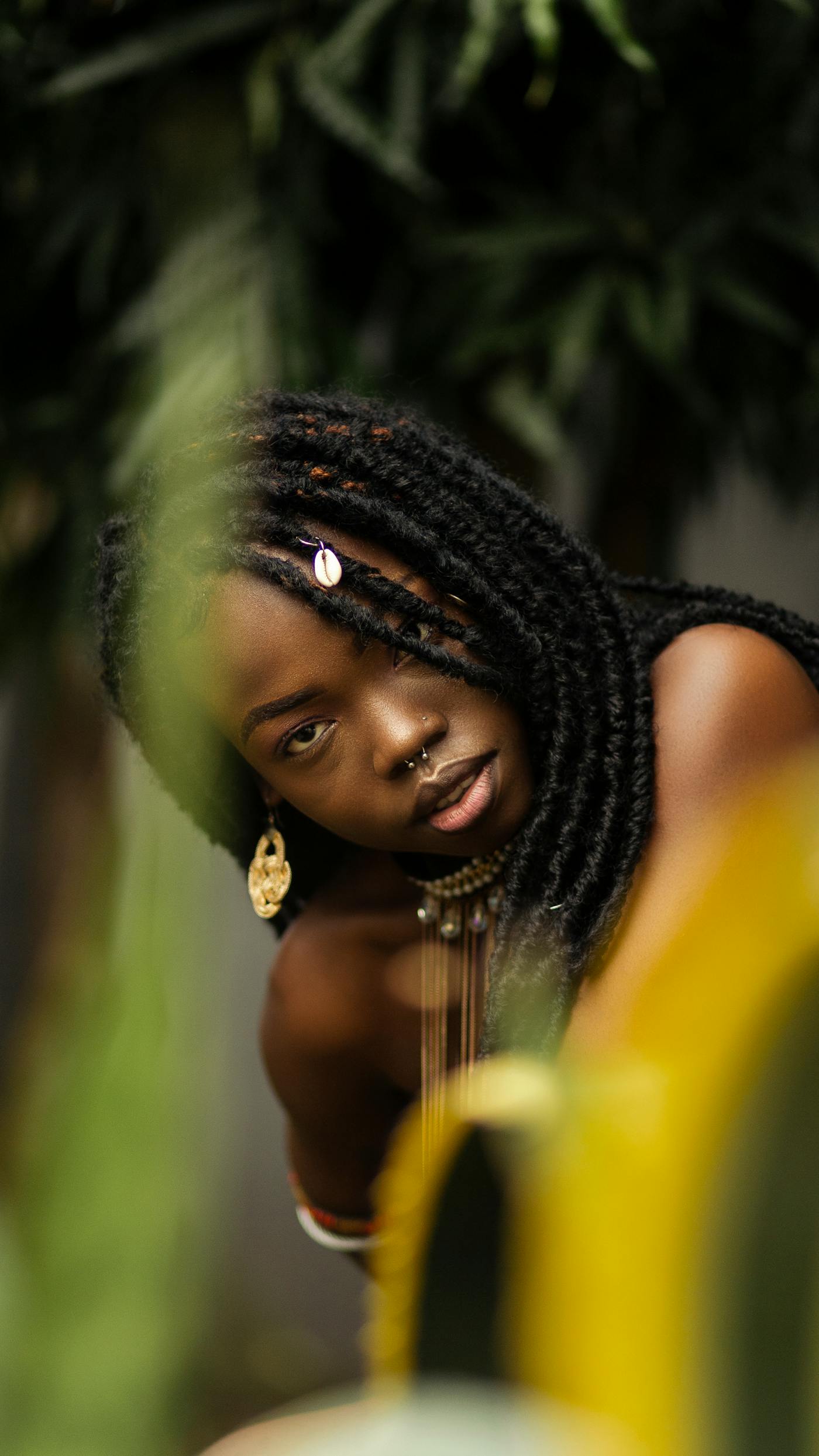 Boho twists with a cowrie shell and beads, in greenery