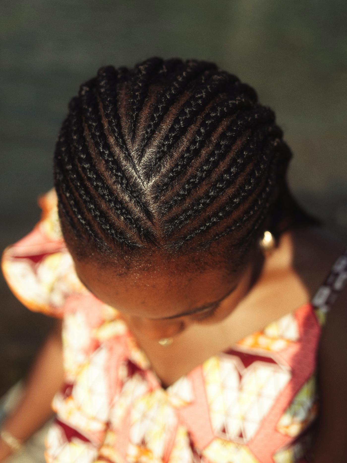 Iverson-style feed-in cornrows from the top, showing immaculate parting