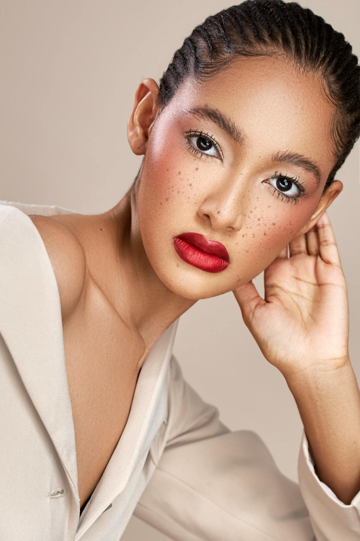 Soft natural-glam face with a clean red lip