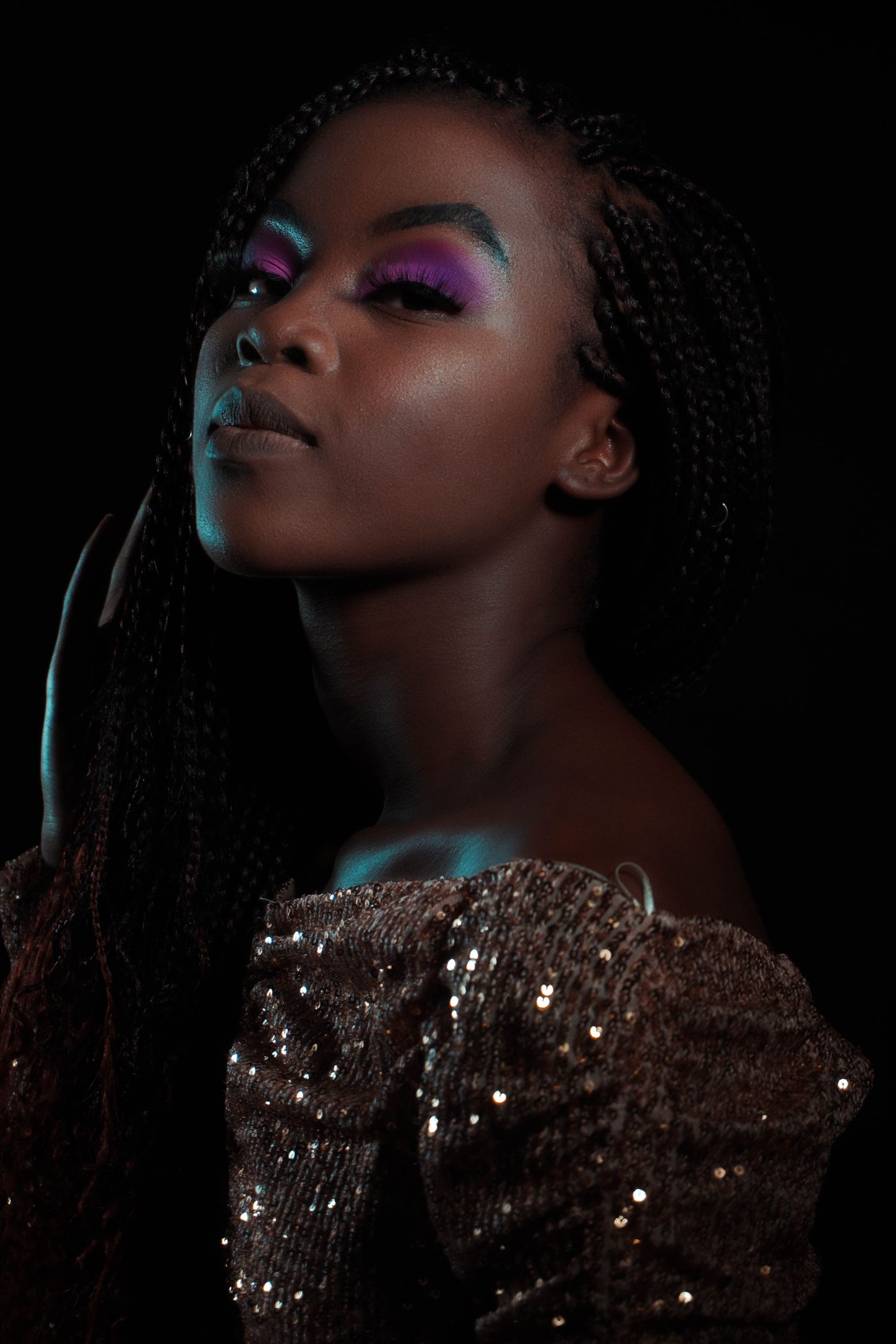 An editorial beauty portrait under warm gold light — representative of the natural-glam style