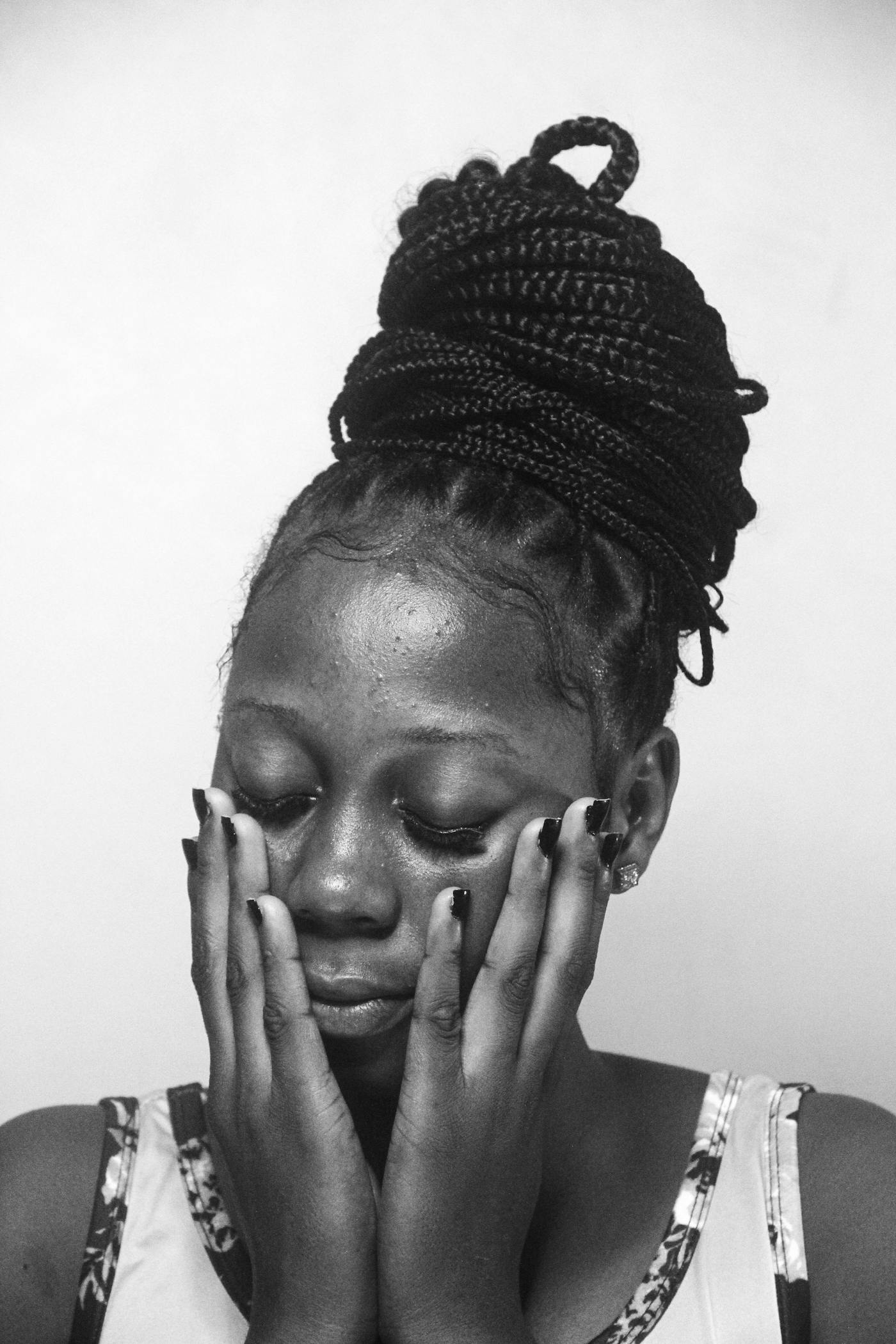 Box braids gathered into a high updo