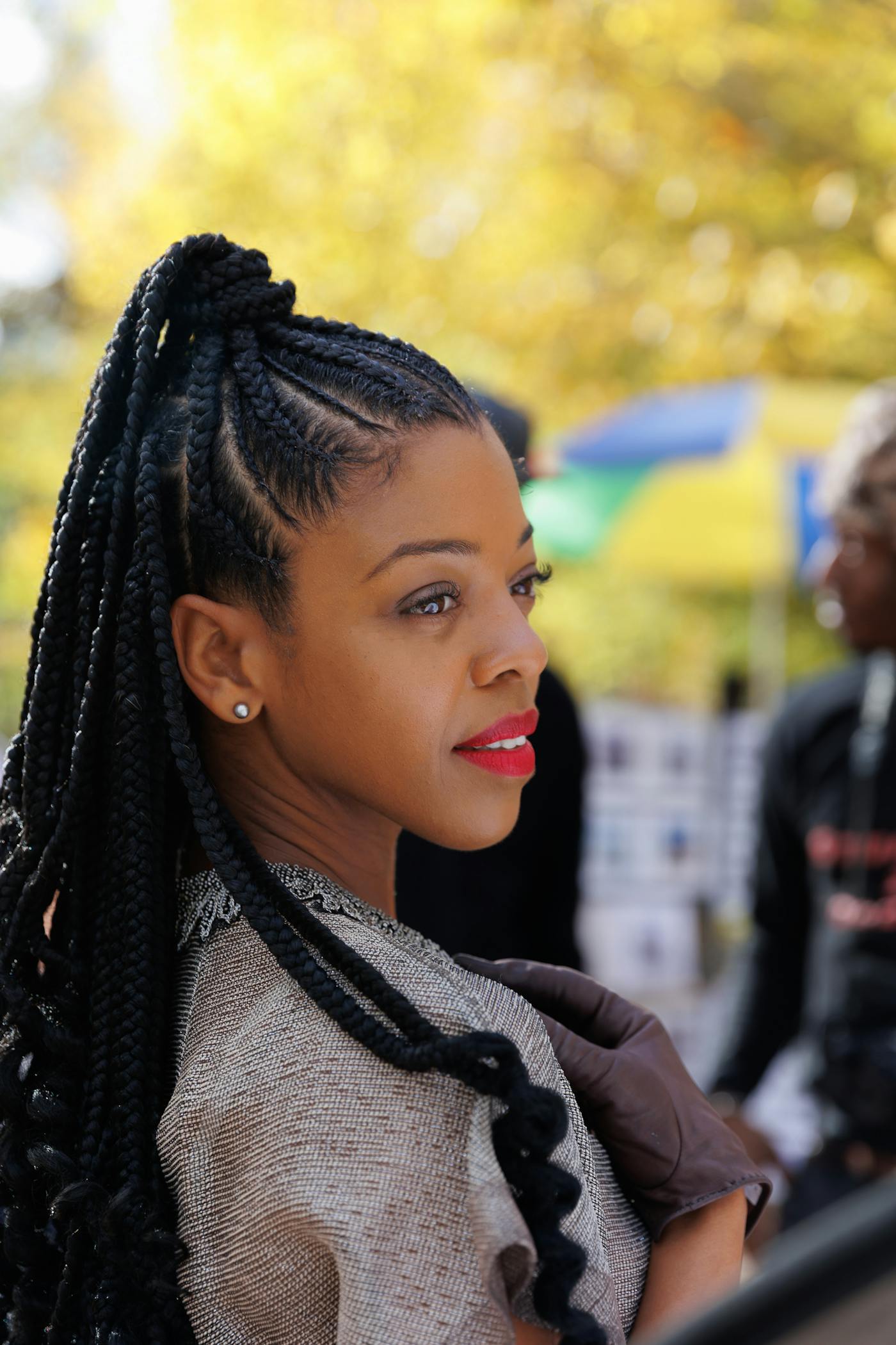 Neat cornrows leading into a braided ponytail