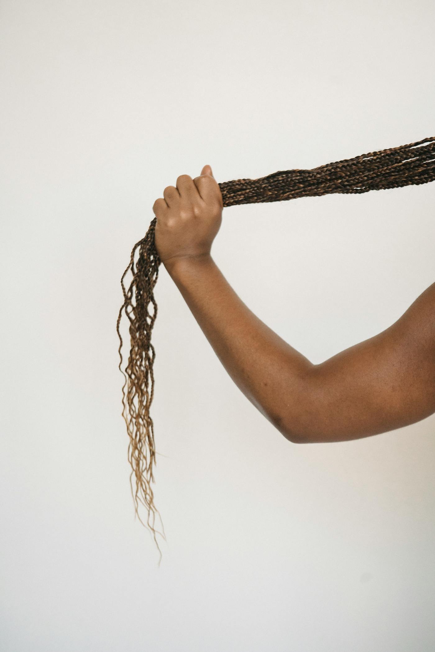 A single long braid held up to show the finish along its length