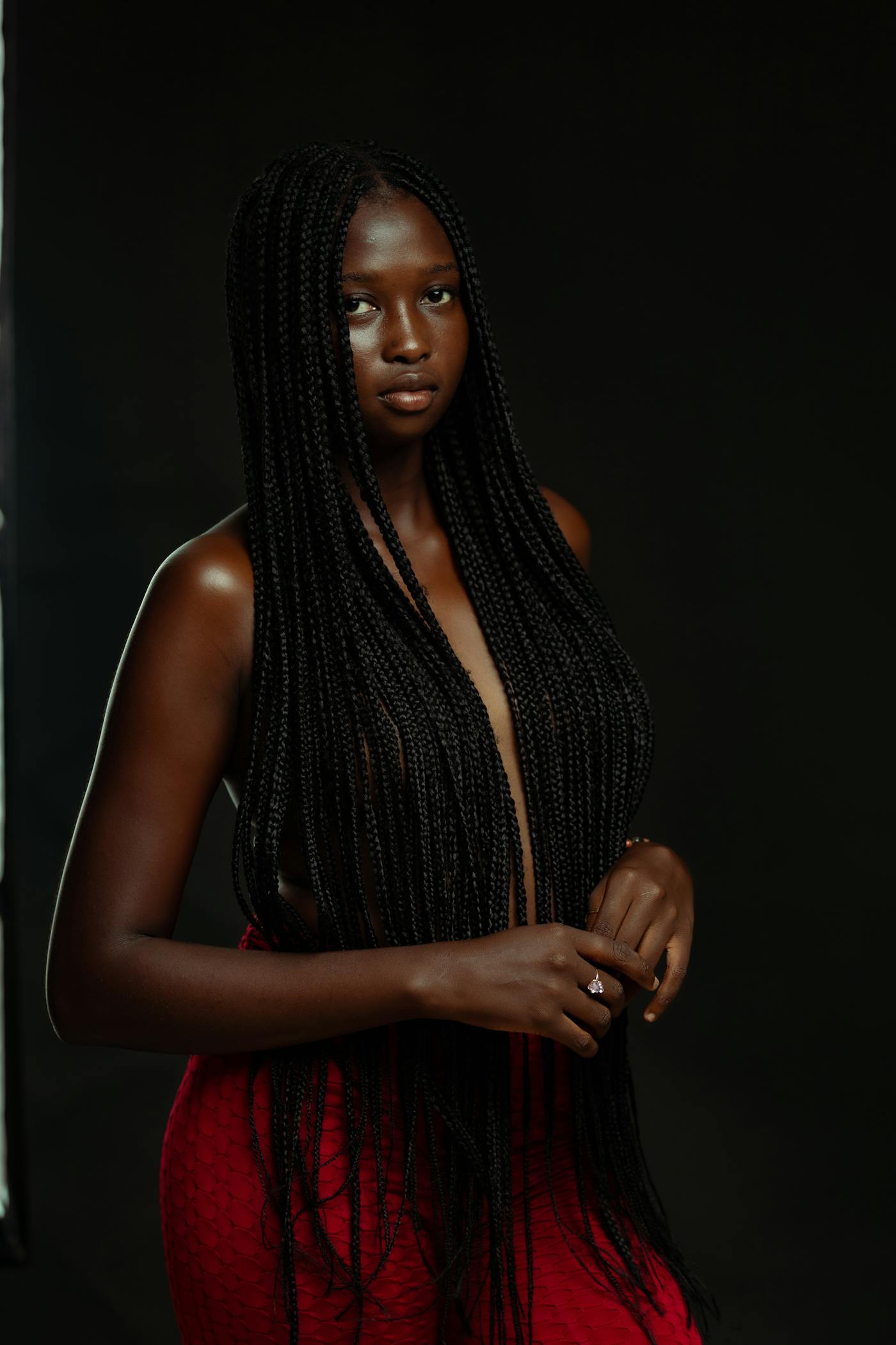 Long box braids, finished and worn with a quiet, regal poise