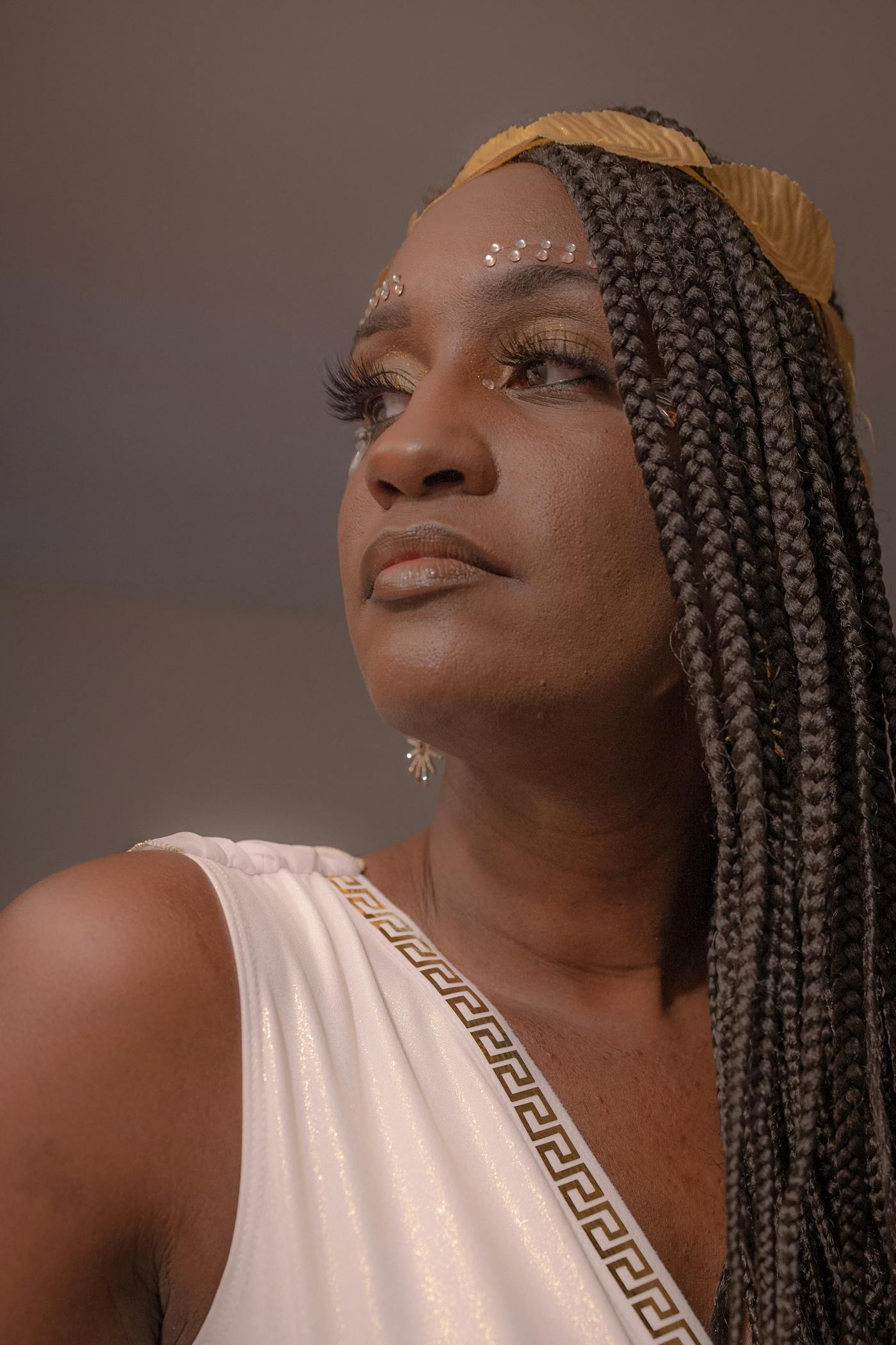 A braided style finished with a gold adornment