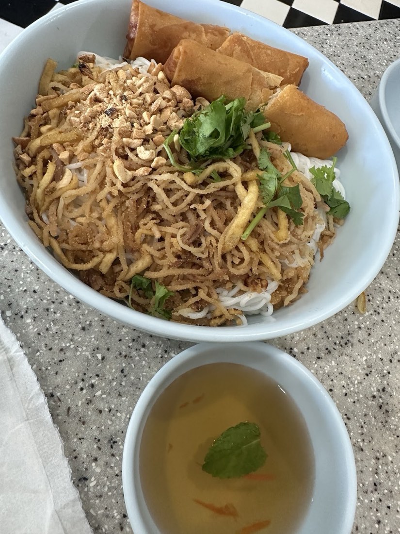 Vermicelli bowl with crispy fried spring rolls, crushed peanut and fried shallot