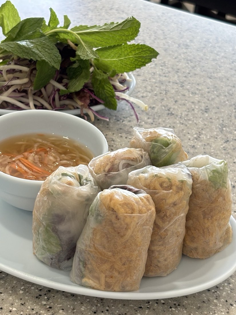 Fresh spring rolls with veggie shrimp, served with a side of mint and dipping sauce