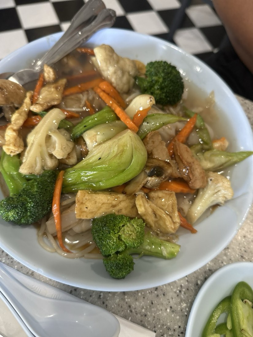 Stir-fried rice noodles with broccoli, bok choy, carrot and tofu